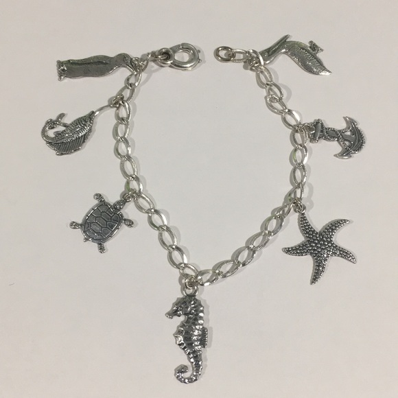 Jewelry - Sterling Silver Bracelet With 7 Different Charms